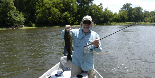 Byron Begley holding a 20" smallmouth caught on the Holston River June 2014